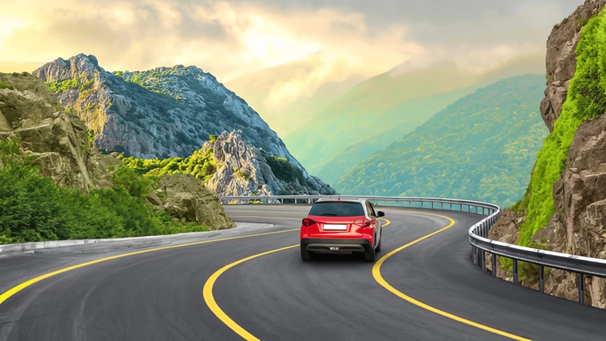 A clean, well-kept red SUV on a winding road, the kind of vehicle that earns a strong trade-in offer
